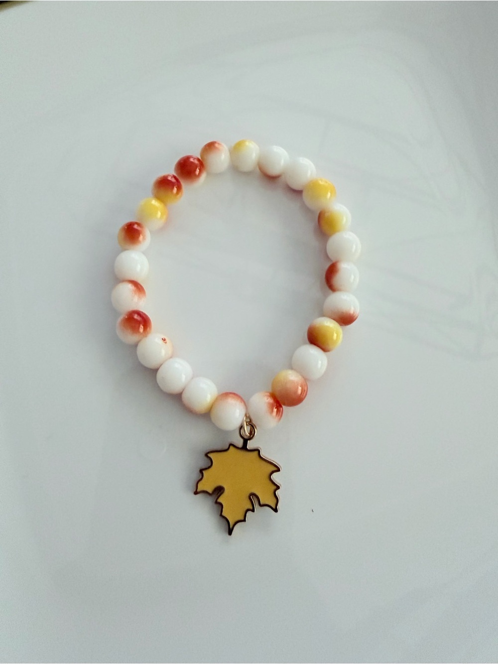 Yellow & White Beaded Bracelet with Maple Leaf Charm